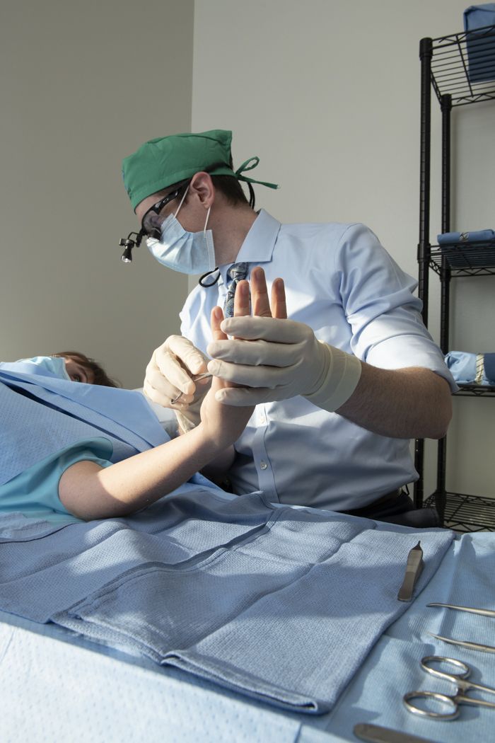 Dr. Christopher M. Bates with a patient